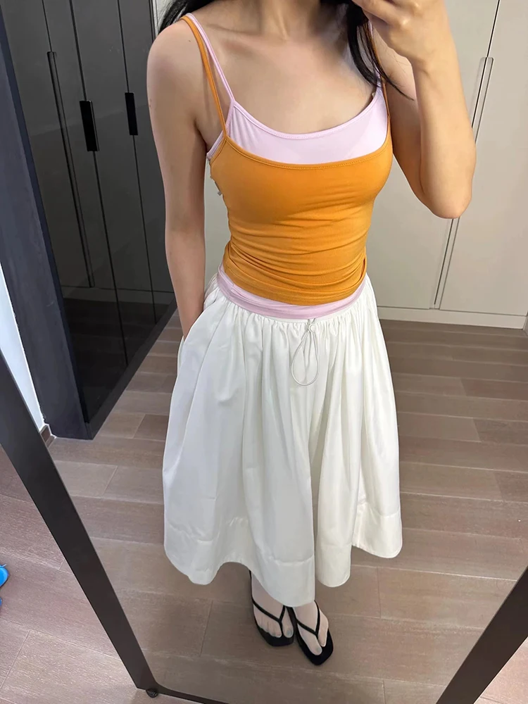 

A two-piece halter top with contrasting colors and layering for the summer of 2025, which is a slimming and form-fitting top