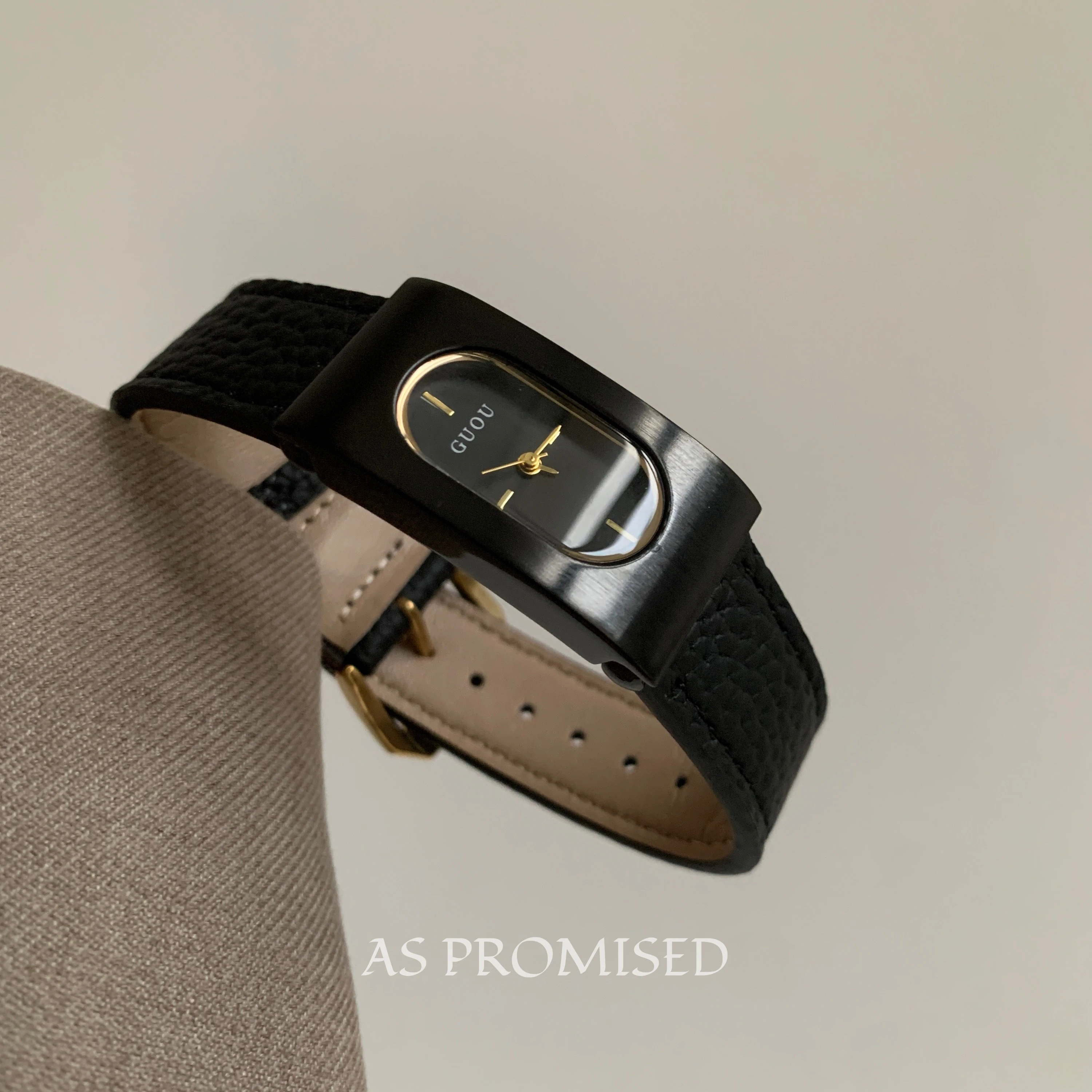A stylish and classic black rectangular quartz watch for women, featuring a sophisticated design and a high-end, luxurious feel.