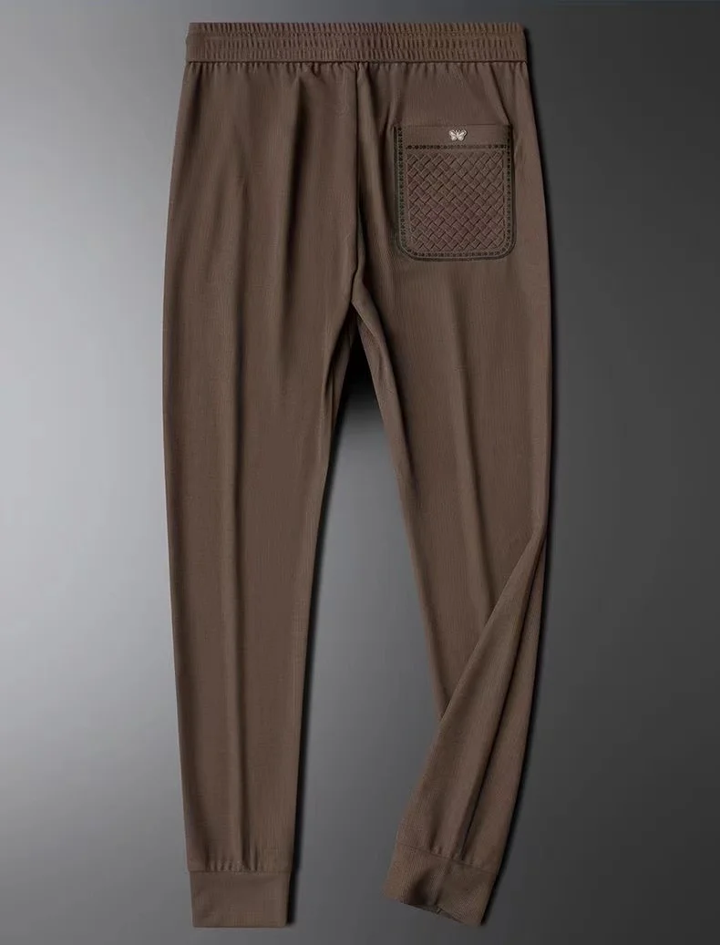 Light Luxury 2024 primavera e autunno Fashion Brand ricamo pantaloni Casual pantaloni morbidi lisci in seta da uomo pantaloni sportivi di fascia alta