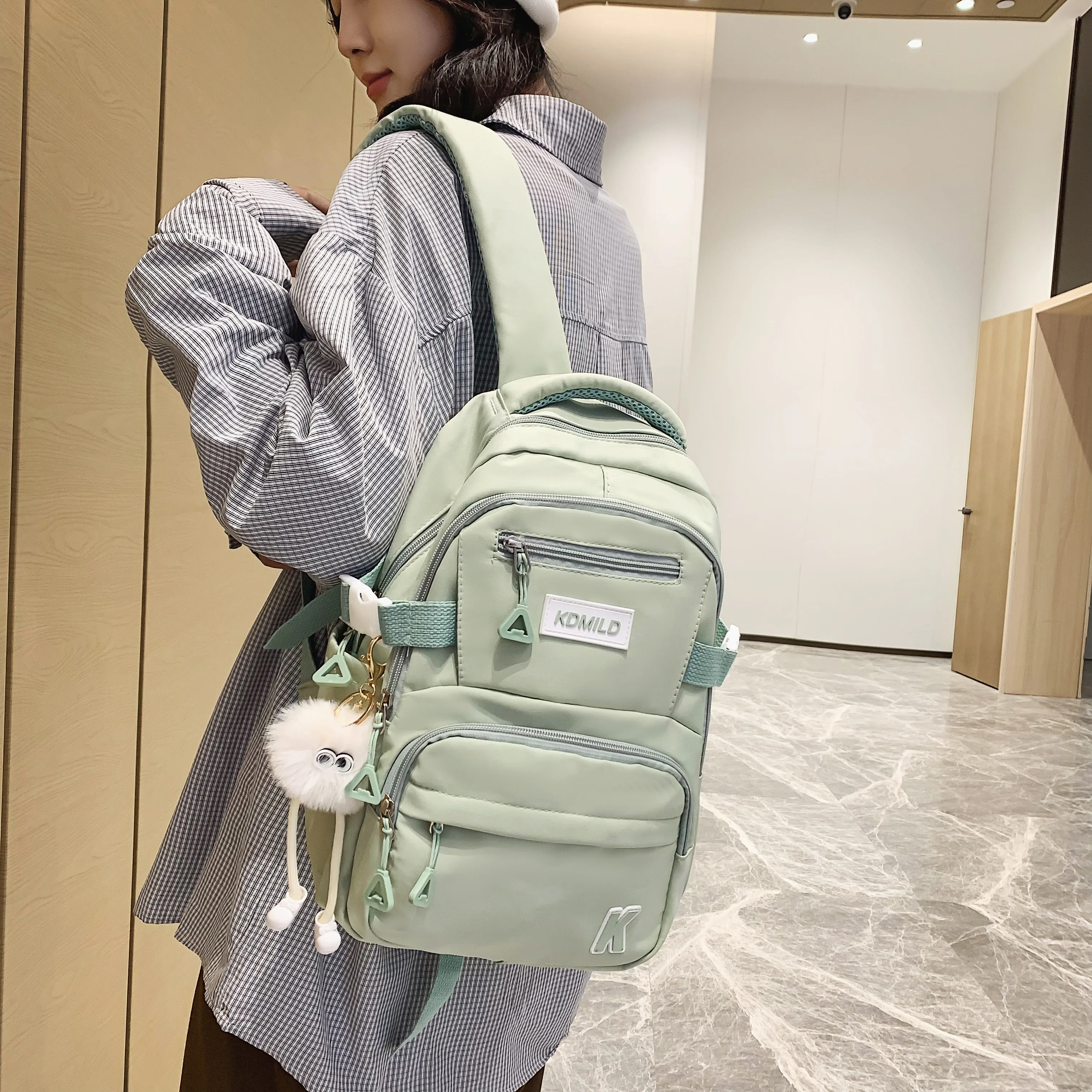 Name:A Stylish Cute Lightweight Backpack Solid Color Multi-pockets For Work Commuting Student School Bag With A Pendant