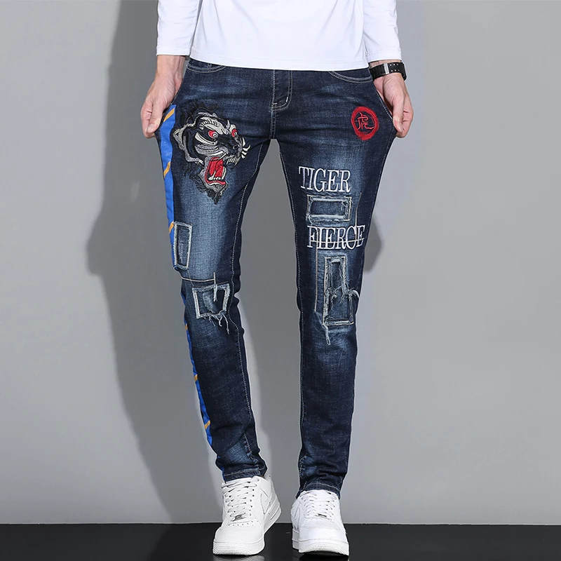 Pantalones vaqueros con estampado de rayas de tigre para hombre, ropa de calle personalizada con letras bordadas, moda de empalme, tendencia