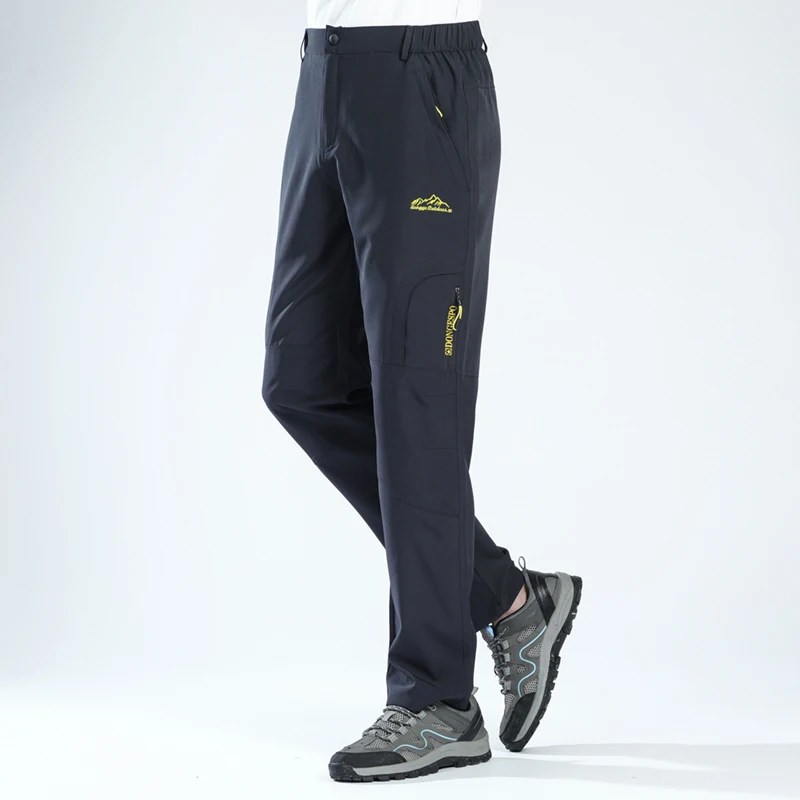 Outdoor sports quick drying pants for men, loose and elastic, with multiple pockets. Quick drying, breathable, waterproof, and u