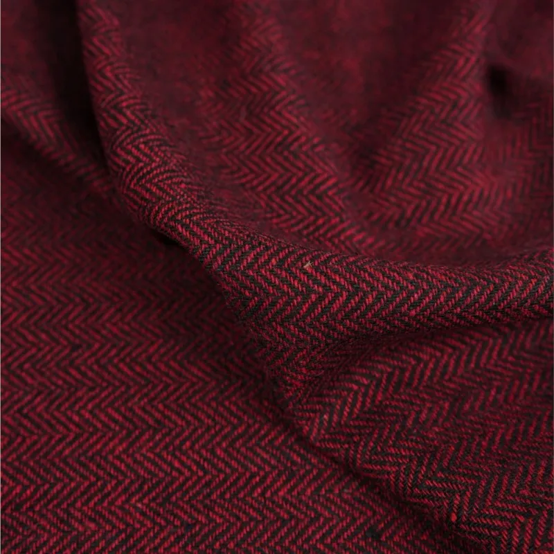 Red and black contrasting letter-patterned fine-spun woolen fabric is used as the for handcrafted outerwear suits