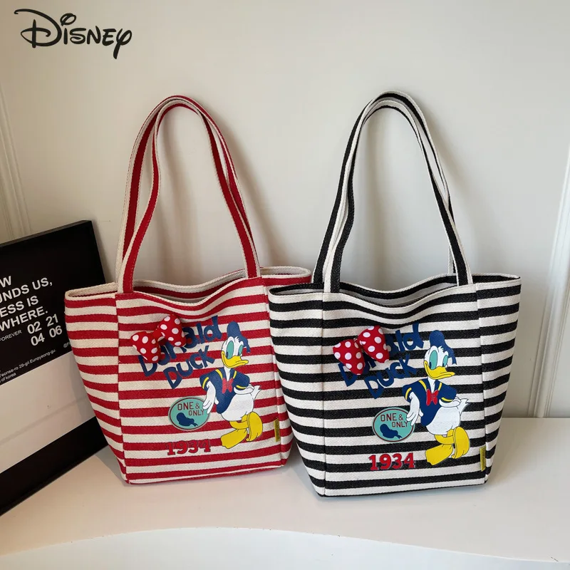 

Donald Duck Cartoon Canvas Bag 2025 New Striped Lazy Handbag Student Handbag Large Capacity Casual Versatile Shoulder Bag