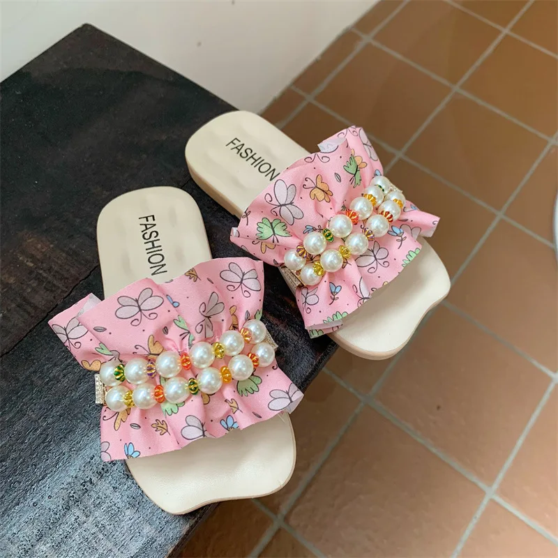 Fairy Cool-zapatillas de estilo coreano para niña, chanclas con volantes florales y perlas, fondo plano