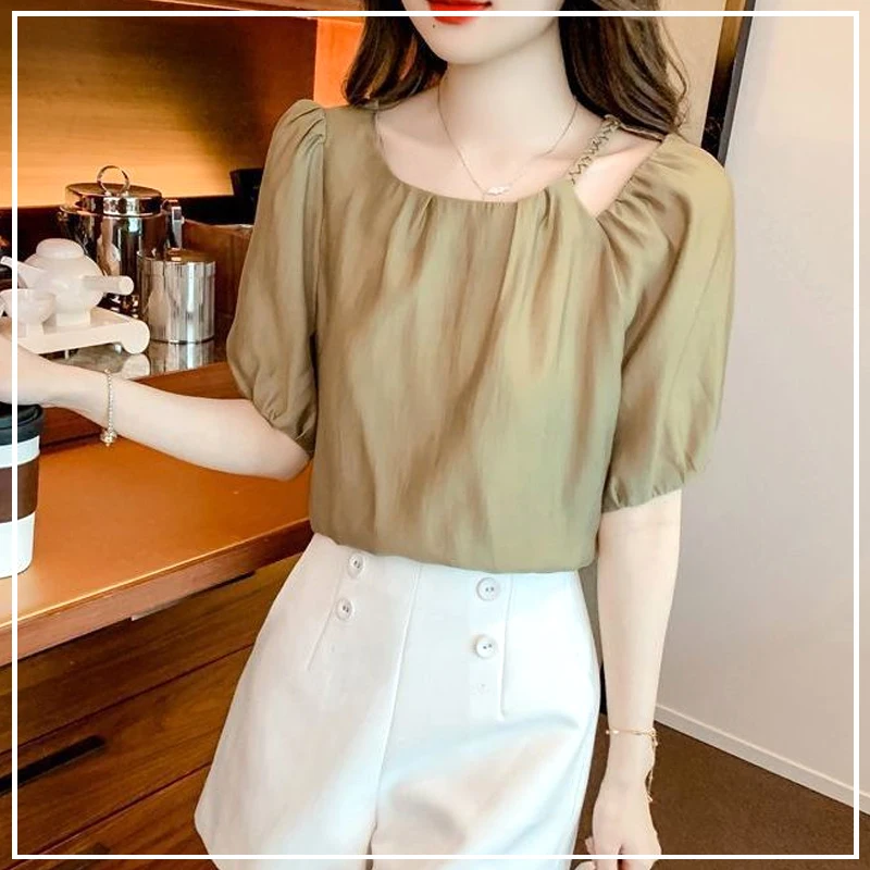 

2024 New Summer Elegant French High-end Fashion Round Neck Hollowed Out Loose and Simple Casual Versatile Bubble Sleeve Shirt