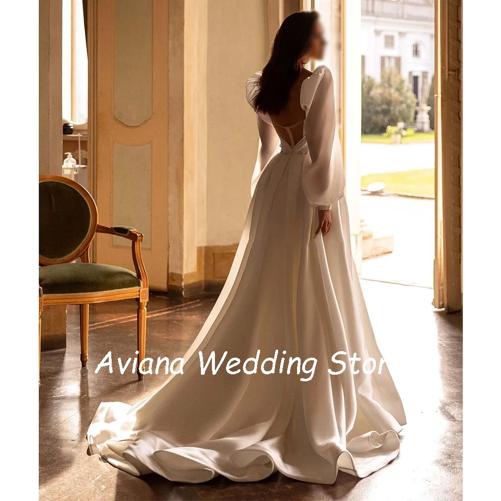 Aangepaste lieverd elegante lange satijnen trouwjurken gezwollen mouwen a-lijn bruidjurken illusie bedekt rug sweep trein 2025