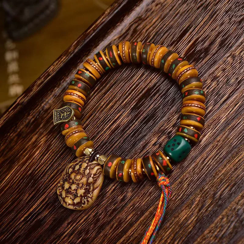 

Tibetan camel bone disc bead strings old copper inlaid reflux bone men and women models retro Tibetan play bracelet jewellery