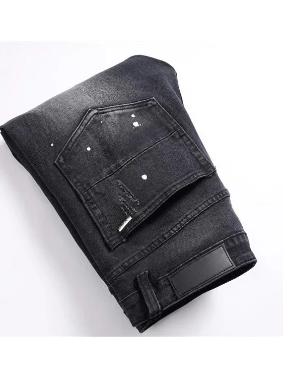 ファッショナブルでトレンディなメンズスリムフィットデニムジーンズ、リペアパッチ付き、伸縮性のあるカジュアルロングパンツ、ブラックホールデザイン、若者向け