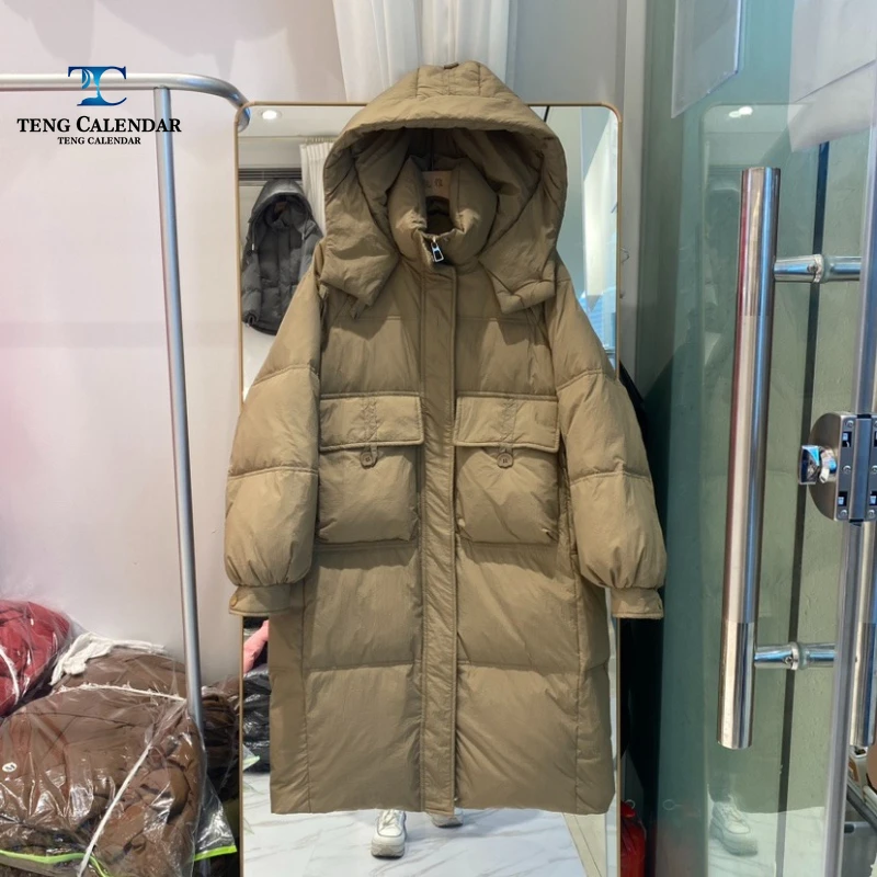 Doudoune à capuche cintrée à la taille de style coréen, doudoune au-dessus du genou épaisse et chaude de moyenne à longue, nouveau style d'hiver 2025 pour femmes