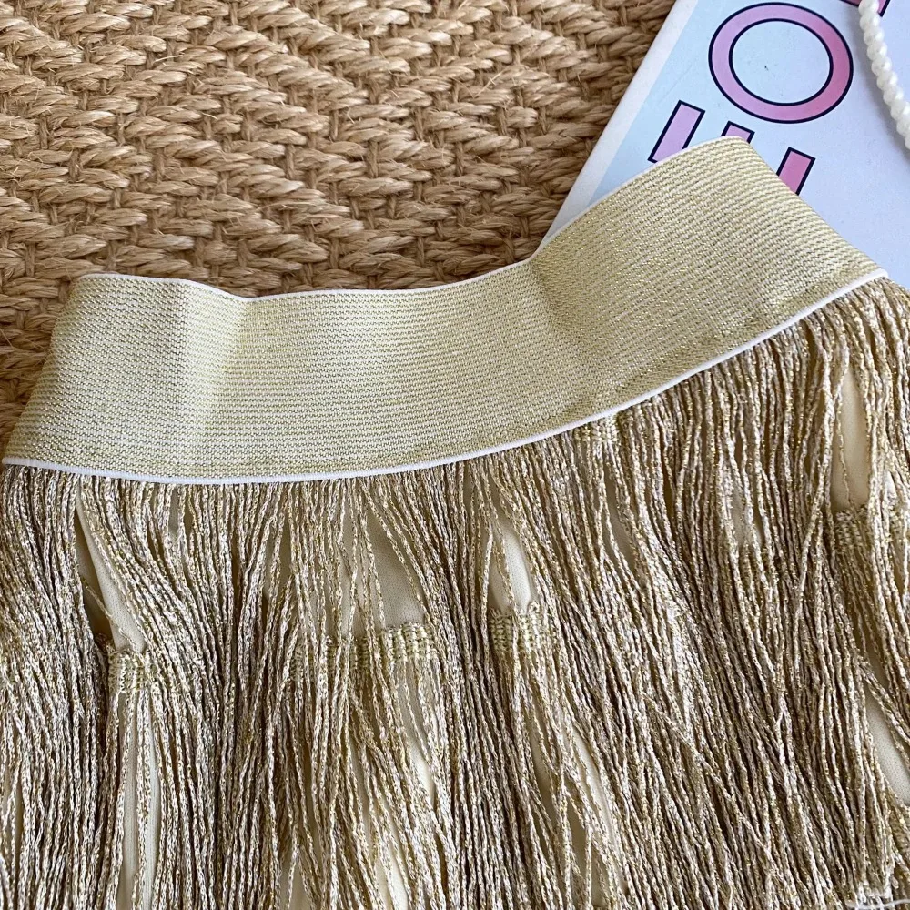 Elegancka, słodka, brokatowa spódniczka mini z frędzlami, elastyczną talią, seksowna, w kształcie litery A, na imprezę, modna, vintage, luksusowa, gotycka, wiosenno-letnia odzież damska.