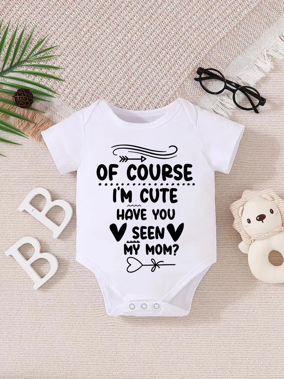 Baby short-sleeved triangle bodysuit, fun letter print, button design, easy to care for, suitable for new parents.