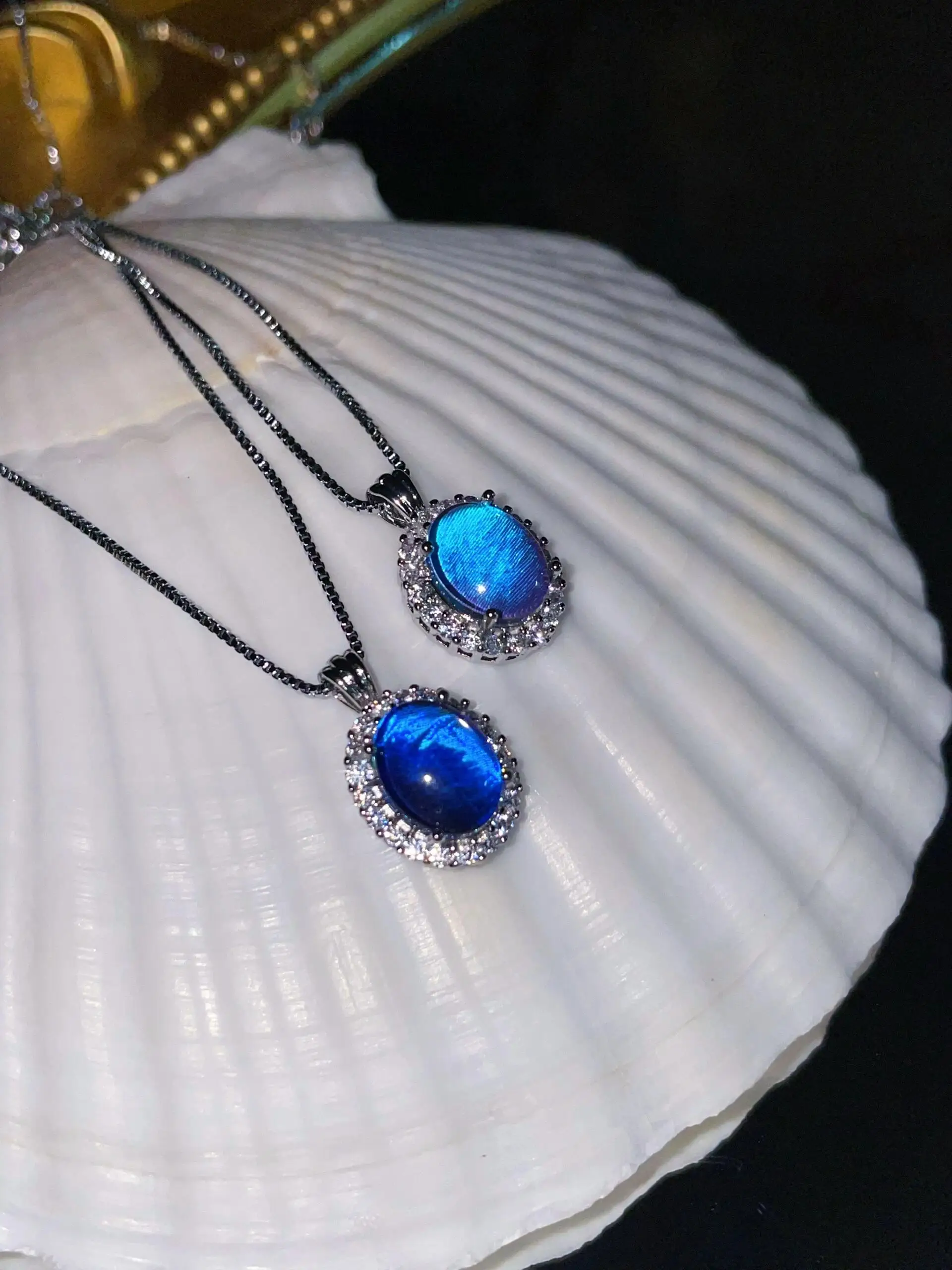 Handcrafted Oval Pendant: Natural Butterflies in Resin with Luminous Blue Morpho, Set in 925 Sterling Silver