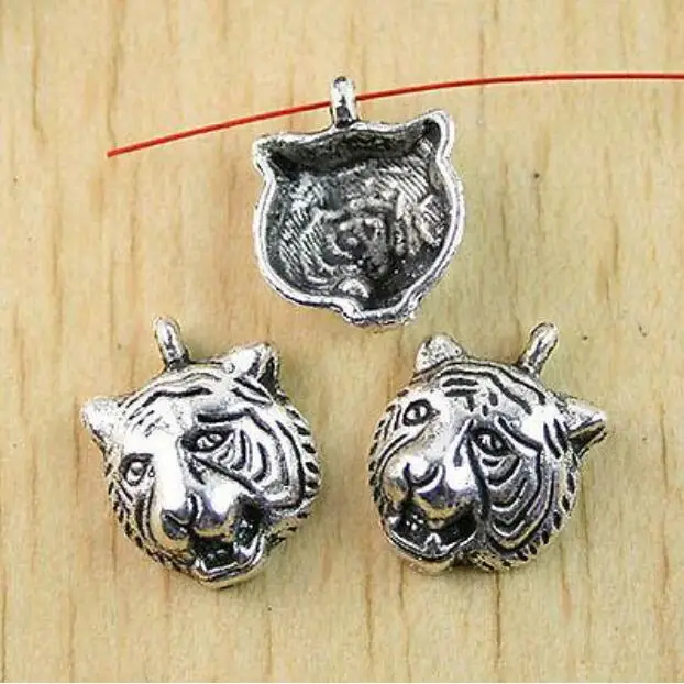 

12pcs 17.6x13.4mm tibetan silver tiger head charms findings h0940