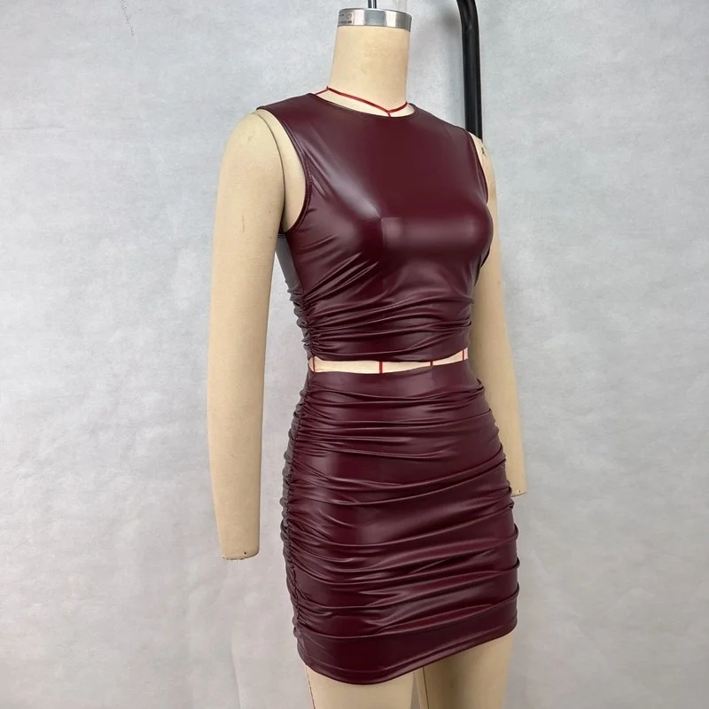 Conjunto de dos piezas de moda para mujer, minifalda de cuero PU, sin mangas, falda plisada de media longitud