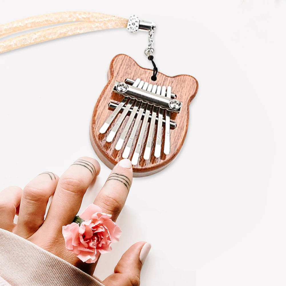 

Eight-tone Mini Pendant Piano Kalimba Musical Caliber Finger Accessories Instruments for Pianos