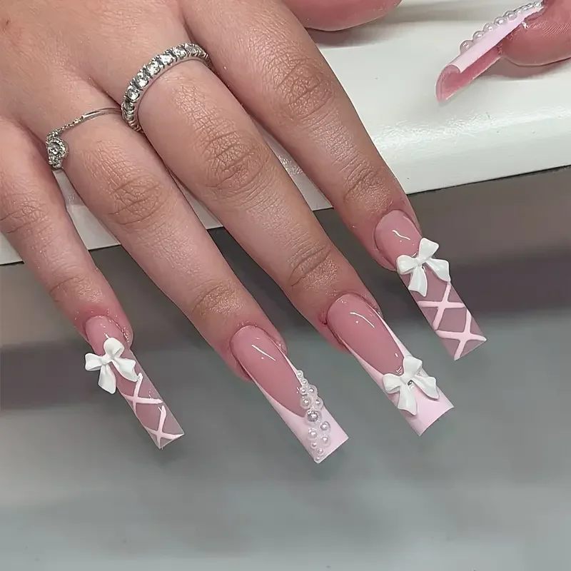 

24Pcs Long Coffin Pink Press-On Nails Glossy Elegance False Nail with 3D Bows,Pearls Stylish Stripes for Women & Girls Nail Art