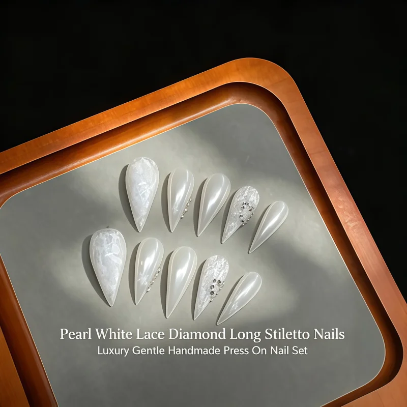 2026New 10PCS Glossy and translucent milky-white dagger-shaped fake nails paired with elegant white lace-printed rhinestones.