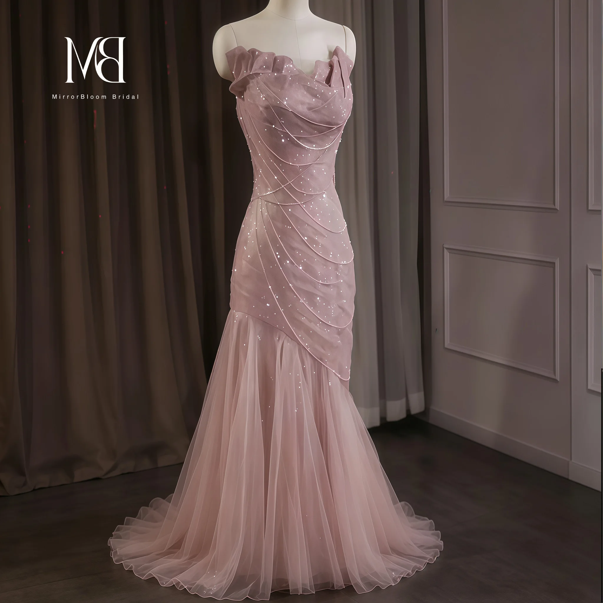 Elegant pink strapless mermaid-style formal gown featuring a shimmering tulle skirt