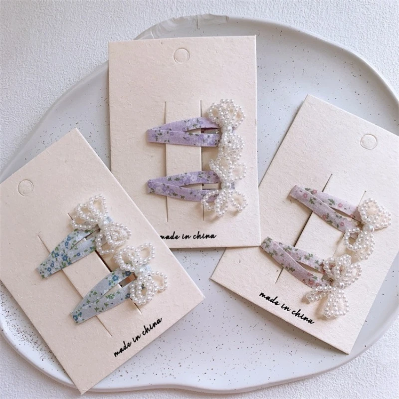 

New cute beaded bow floral BB clips.Secure side hairs & bangs well.Pair-pack design is cost-effective. Sweet, lovely must-haves