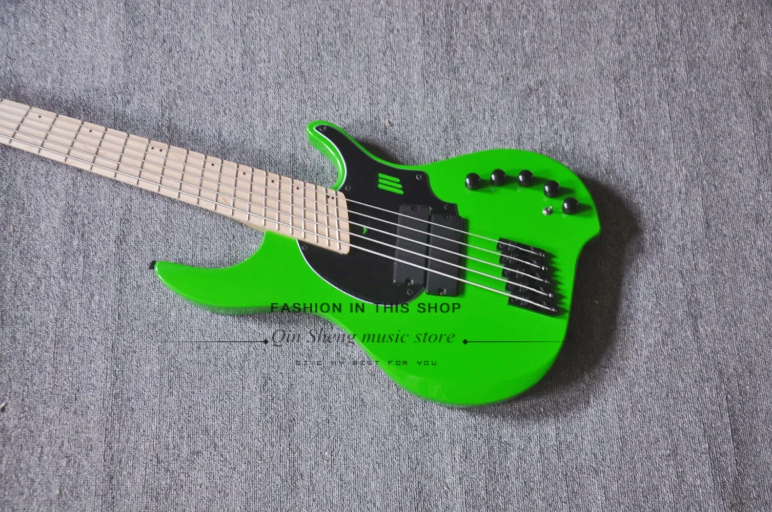 5 string green guitar, black fixed bridge, maple neck, black sealed pickups, black guard plate, customizable