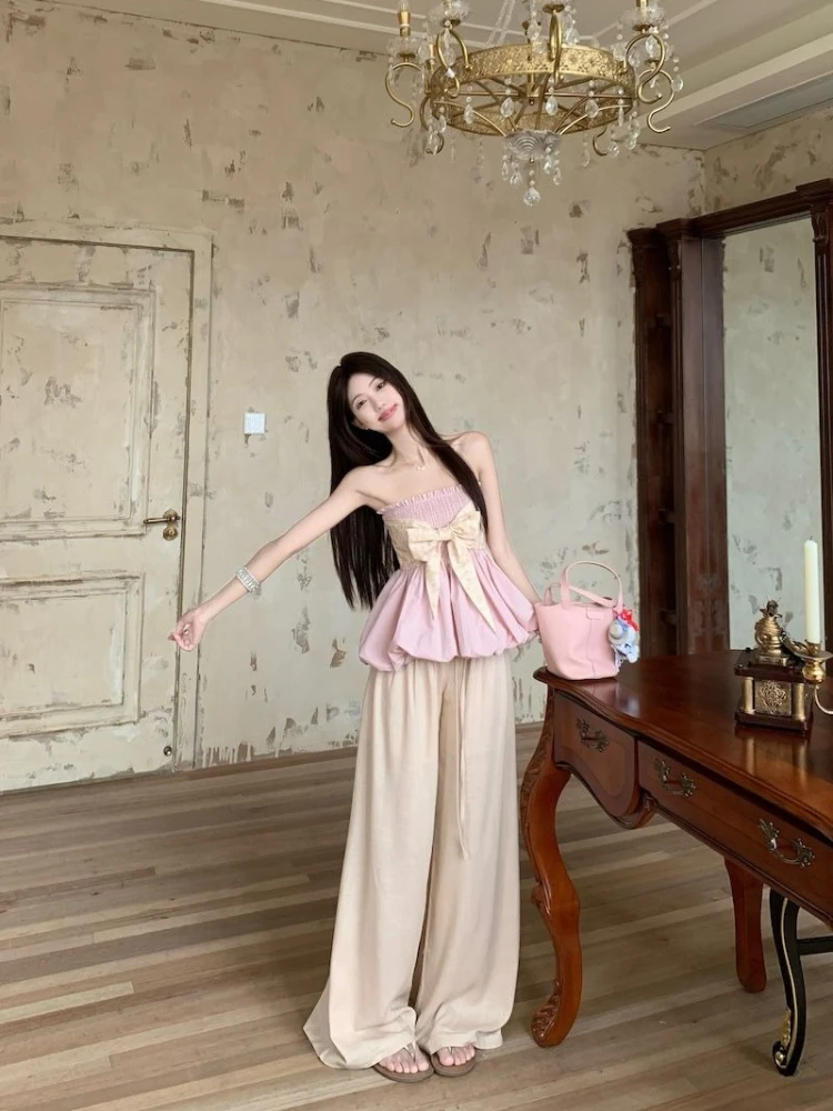 

Сексуальный комплект из двух предметов: топ без бретелек и широкие брюки свободного кроя. Женская летняя повседневная одежда премиум-класса 2026.