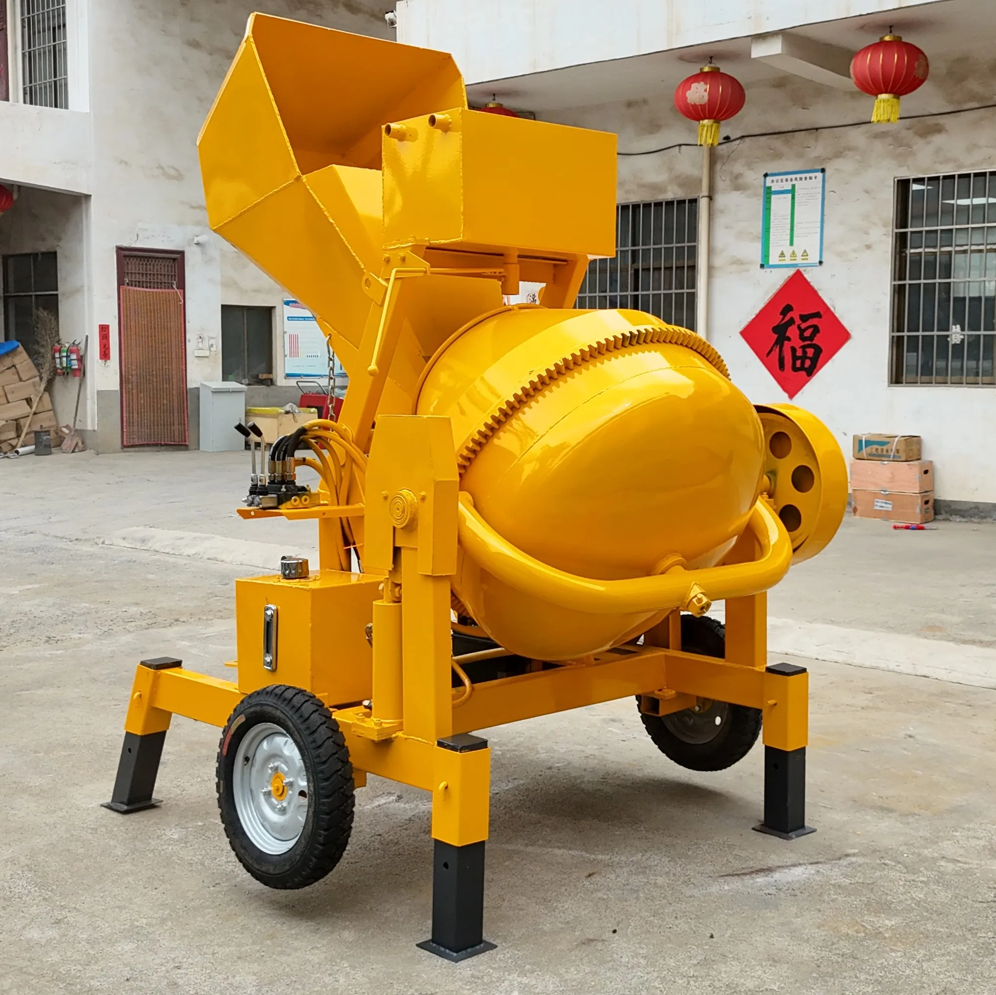 

Electric Hydraulic Feeding Concrete Mixer Small Yellow Can Mobile Mortar Mixer With Four Support Legs