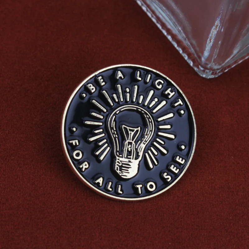 Inspiration for Be a light for all to see pin Light bulb design badge clothing accessories