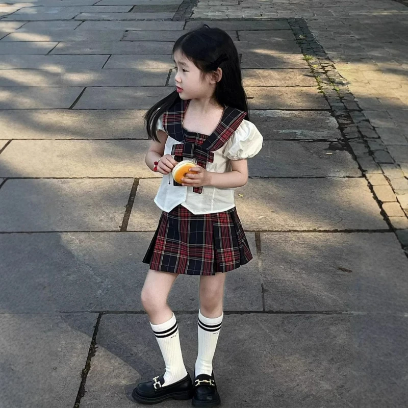 

2025 New Girls' Summer College Style Sub Collar Spliced Cotton Solid Color Top and Plaid Skirt Two-piece Set