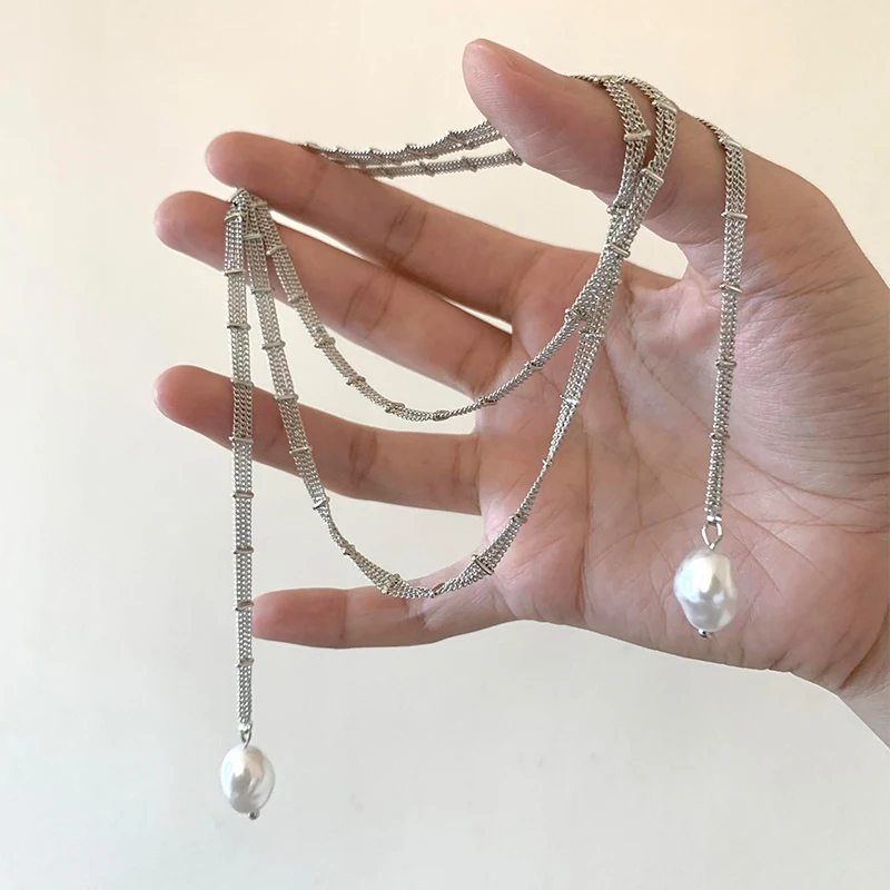 

Silver-white lace chain winding necklace, cold wind design, long stacked pearl collarbone chain