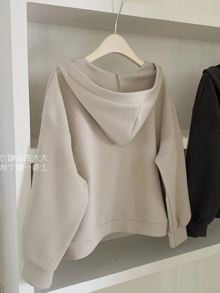 2025 Conjunto de otoño e invierno falda suelta con capucha vestido con cuello colgante chaqueta con capucha suelta moda Casual conjunto de dos piezas para mujer