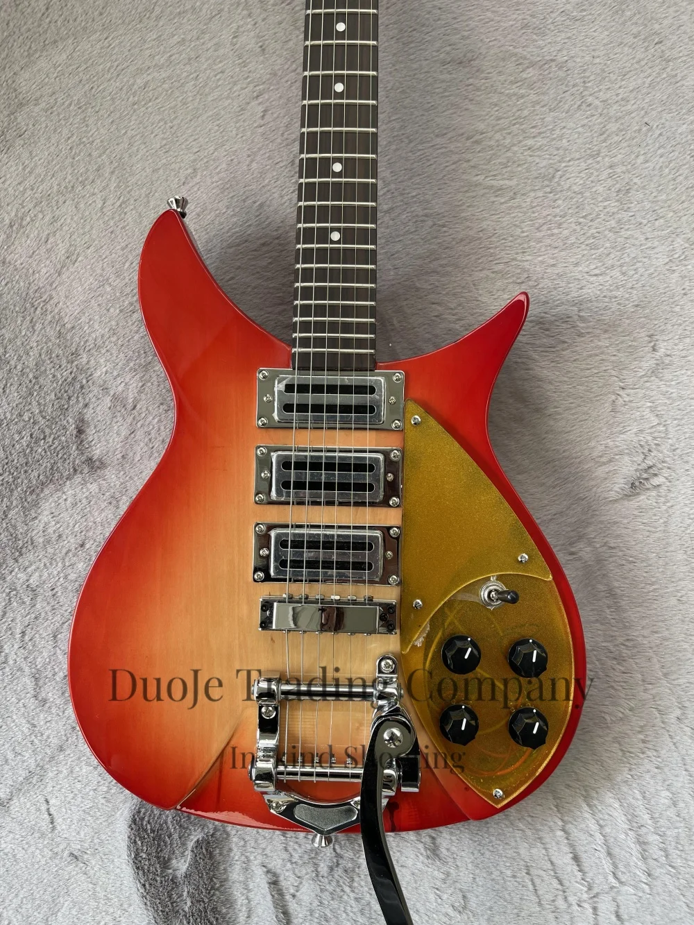 Cherry red guitar, 20.5-inch string length, tremolo bridge, 3 pickups, gold pickguard, solid wood body, maple neck