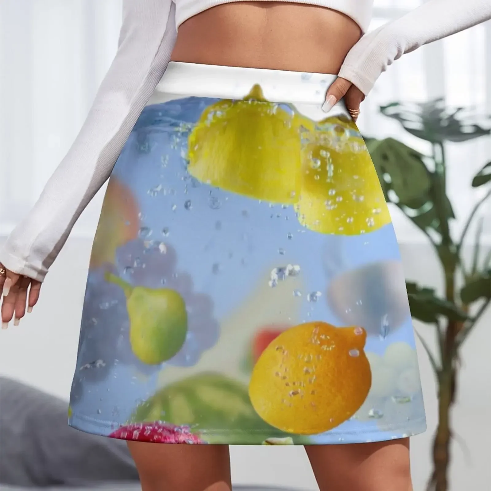 Fresh Fruits shot as they submerged under water background food delicious splash in aquarium Mini Skirt skirt sets