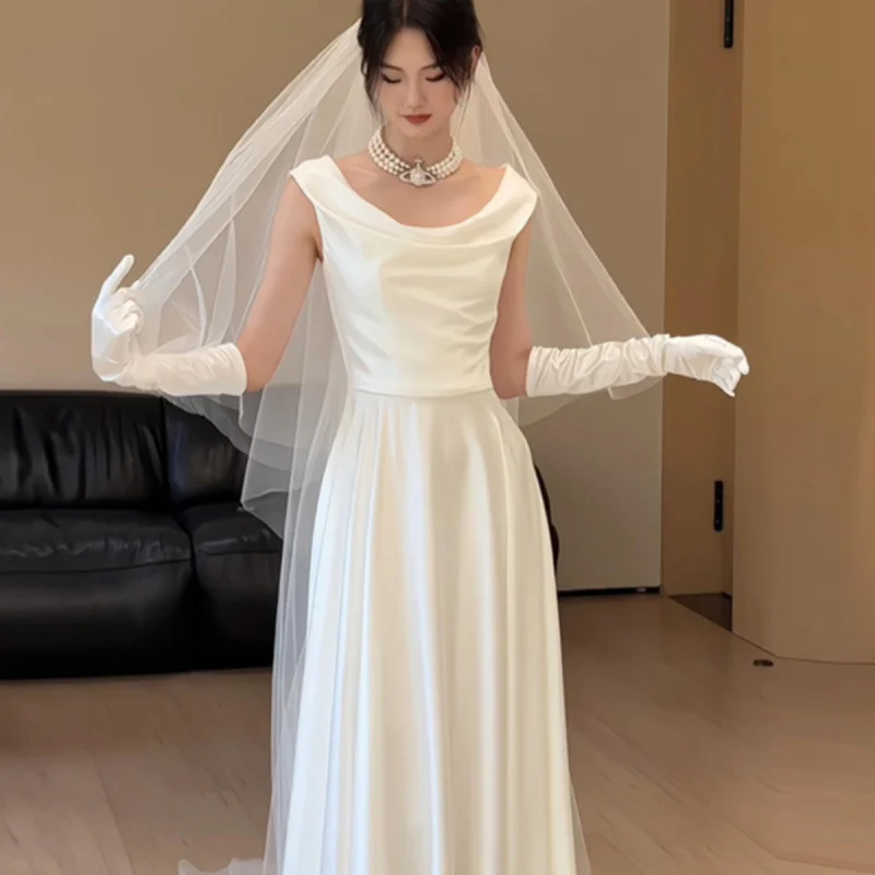 Fotografía de viaje vestido de novia ligero novia Simple de gama alta vestido de novia de satén francés vestido de nicho adelgazante recepción salida velo