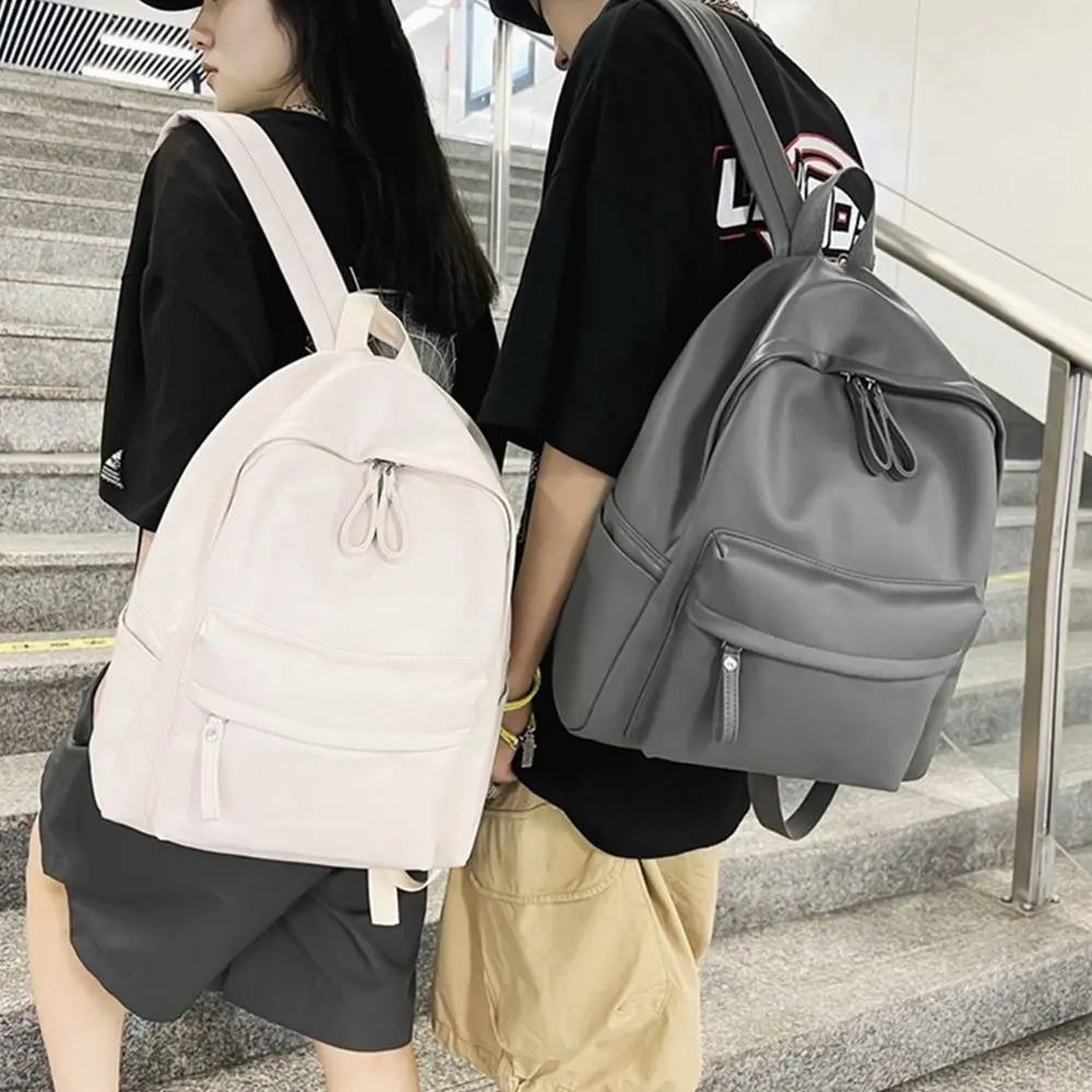 1Pcs New Large Capacity PU Leather Backpack Solid Color Portable School Bag Unisex Waterproof Couple Backpack Men Women