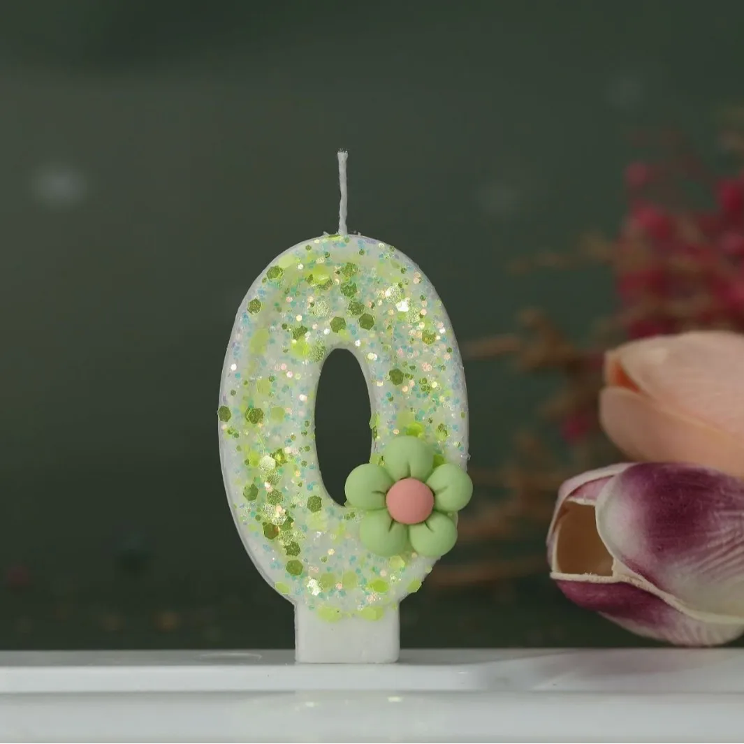 Light green numbered candles, green and pink flower-decorated candles, holiday and commemoration day candles