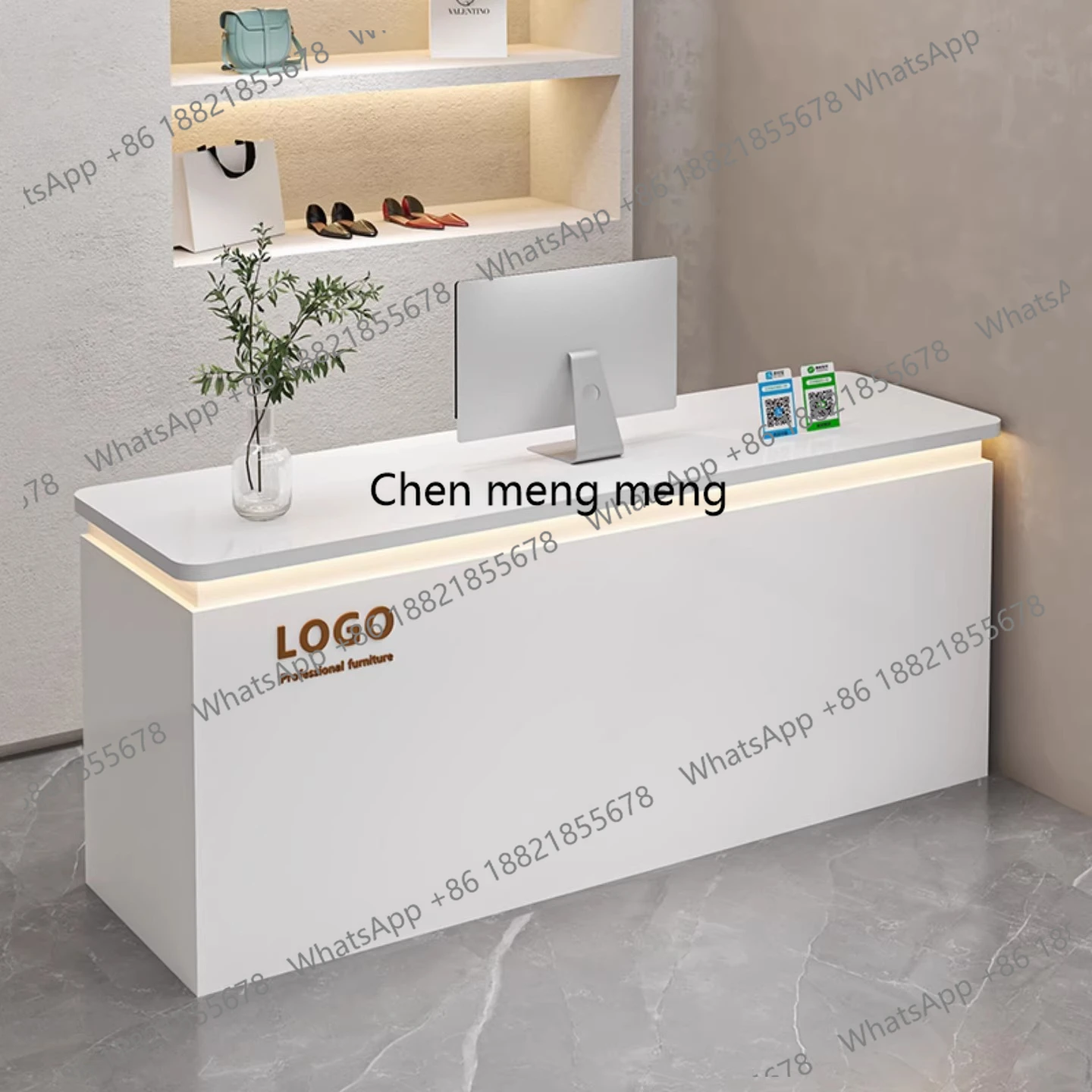 Cashier at the front desk, small bar at the counter of the high-end clothing store