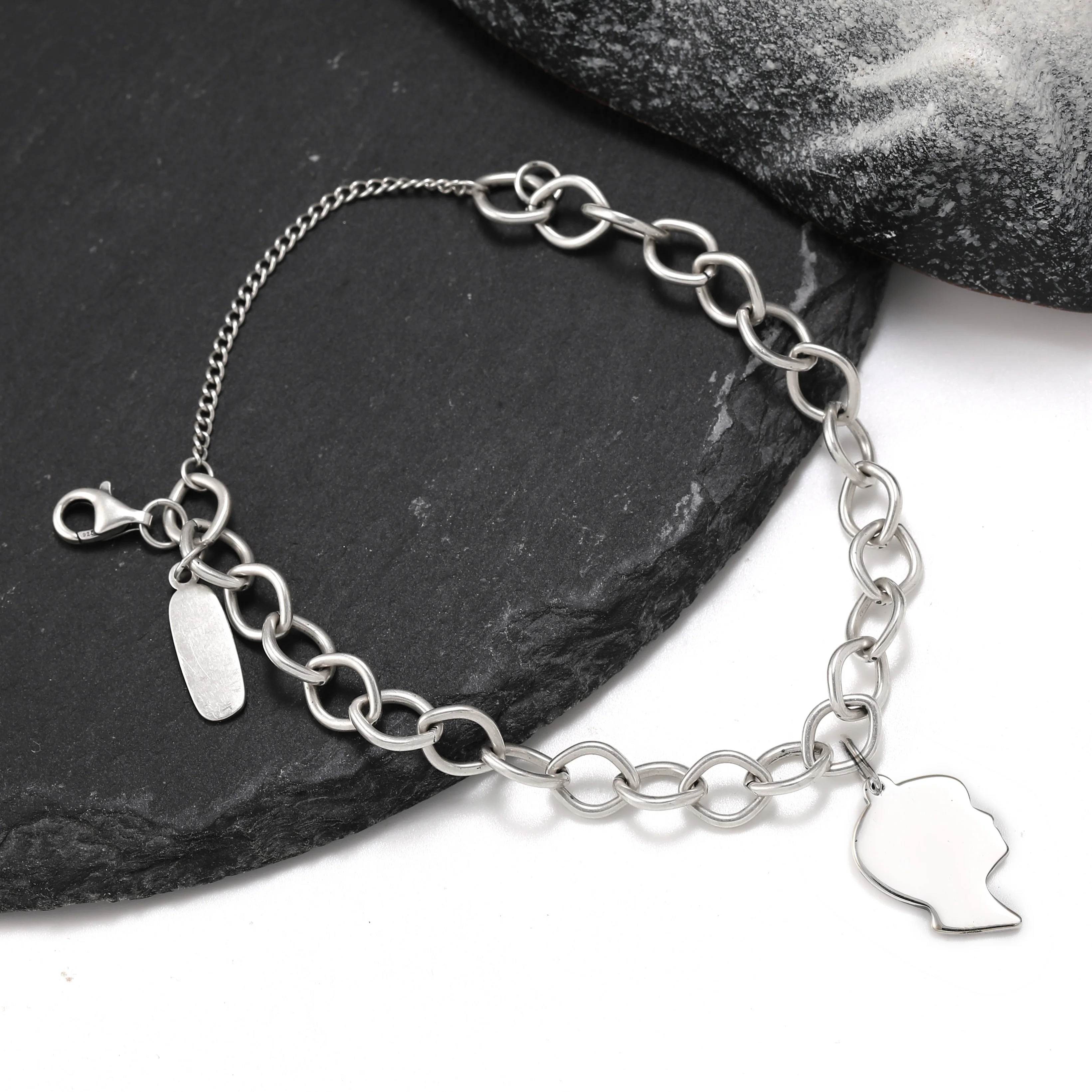 

Genuine 925 sterling silver James Avery Forged Link Charm Bracelet paired with The silhouette of a boy pendant