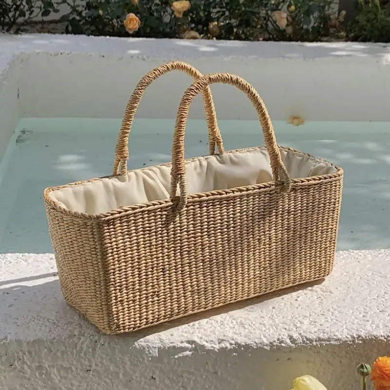 

2025 New French Fashion Retro Horizontal Square Grass Woven Hand-held Women's Bag Woven Hollow Casual Versatile Women Bag Trendy