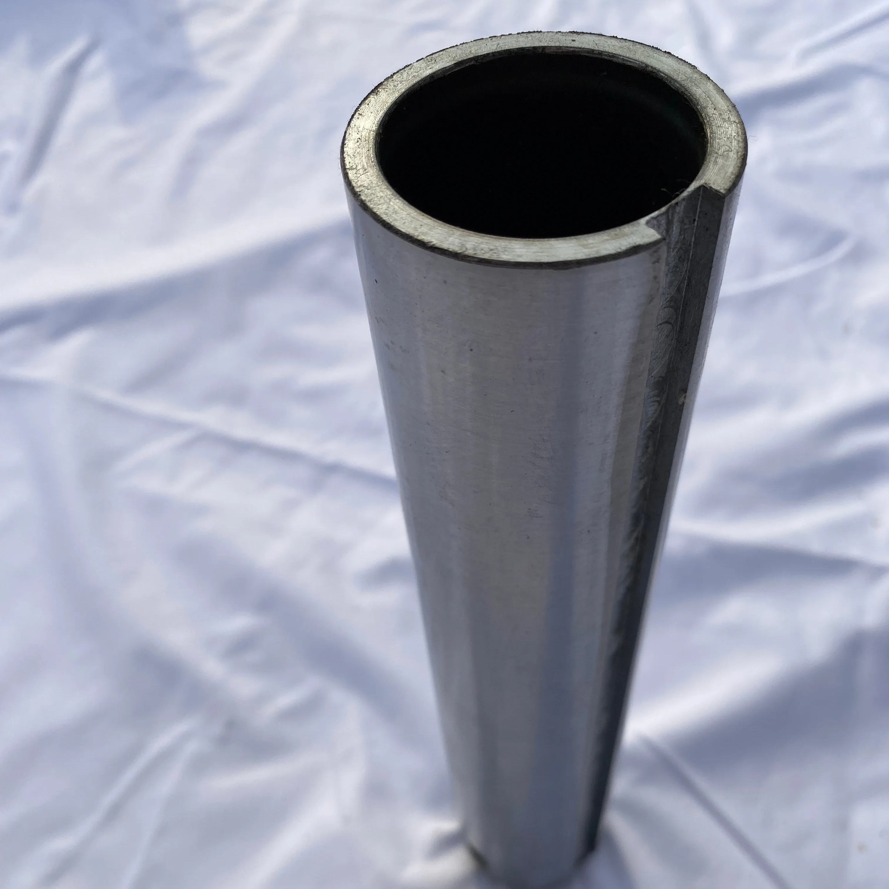

Portable linear boring machine for reboring and welding pin holes of excavators