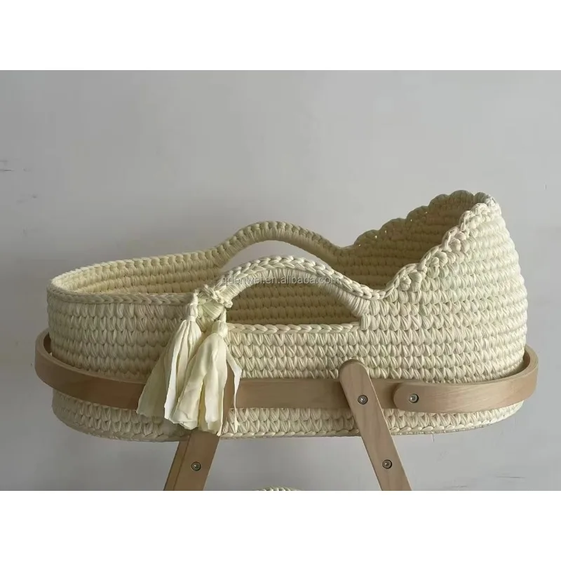 

Soft-padded newborn sleeping basket with removable mattress and handles