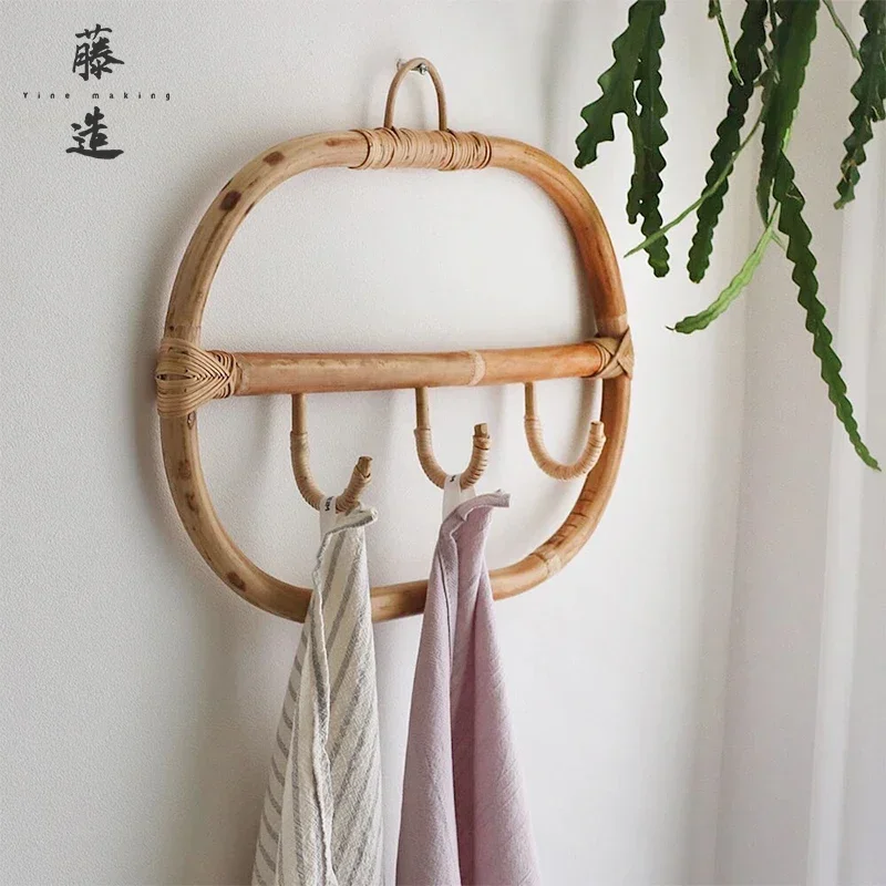 rattan woven wall hanging shelves with hooks for storing creative clothes and hats in the bedroom at the entrance of the house