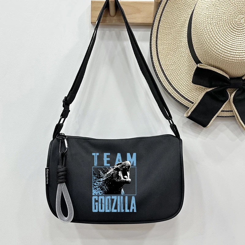 Godzilla Kong ชายผ้าไนลอนกระเป๋าสะพายข้างภาพยนตร์การ์ตูนพิมพ์กันน้ําขนาดใหญ่ความจุกระเป๋าถือกระเป๋า Messenger ผู้หญิงหญิง