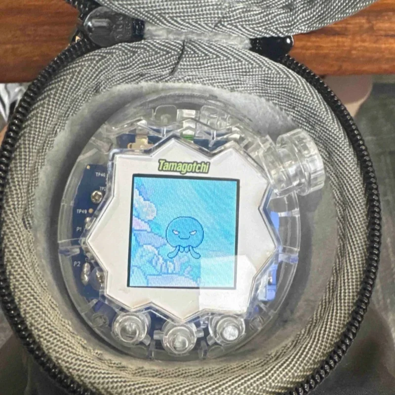 

Новый хит продаж, смена цвета Тамагочи, рай, замена ракушки, райский защитный чехол, фиолетовый и розовый, в наличии