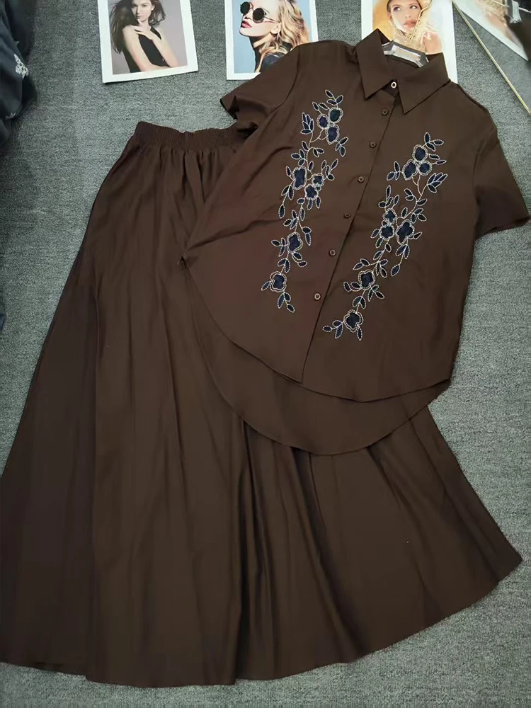 Camicia monopetto a maniche corte ricamata retrò primavera ed estate nuova + gonna in vita elastica abito a due pezzi da donna alla moda