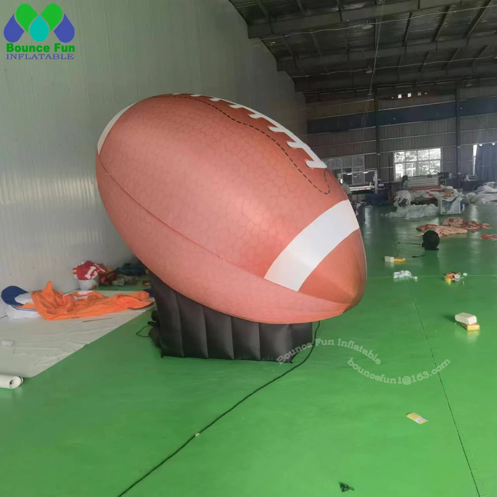 

Best Quality Giant Inflatable Rugby Ball With Base Inflatable American Football For Sports Events Advertising