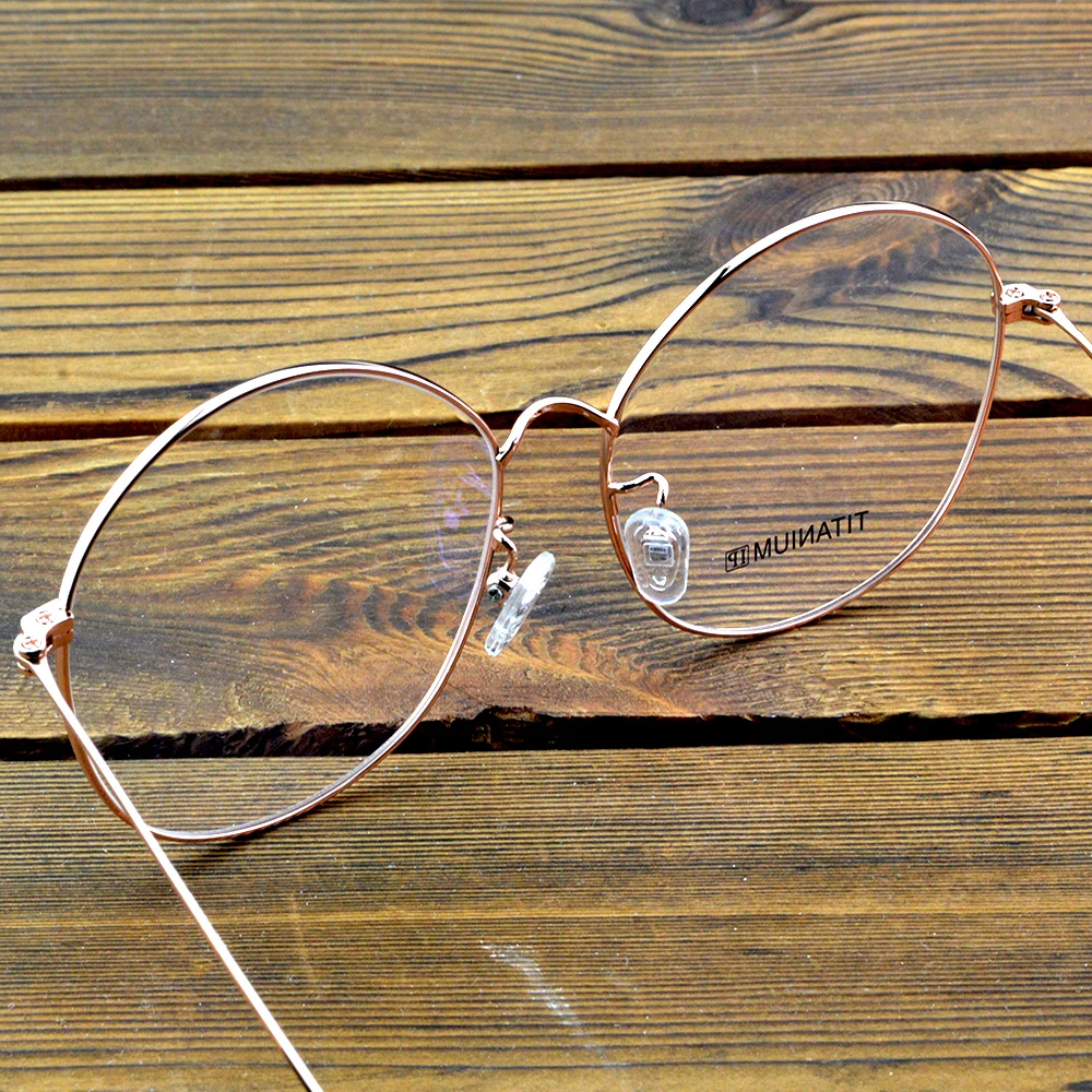 إطار نظارات بصرية دائرية كلاسيكية مطلي بسبائك التيتانيوم مع لمسة نهائية من الذهب الوردي