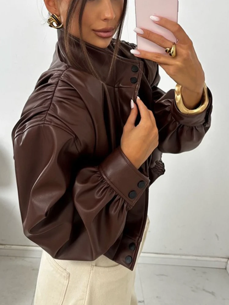 เสื้อแจ็คเก็ตหนังเทียมคอตั้งทรงสั้นสไตล์สตรีทแฟชั่น  แบบต่อผ้าสีพื้น  รุ่นใหม่สำหรับผู้หญิง