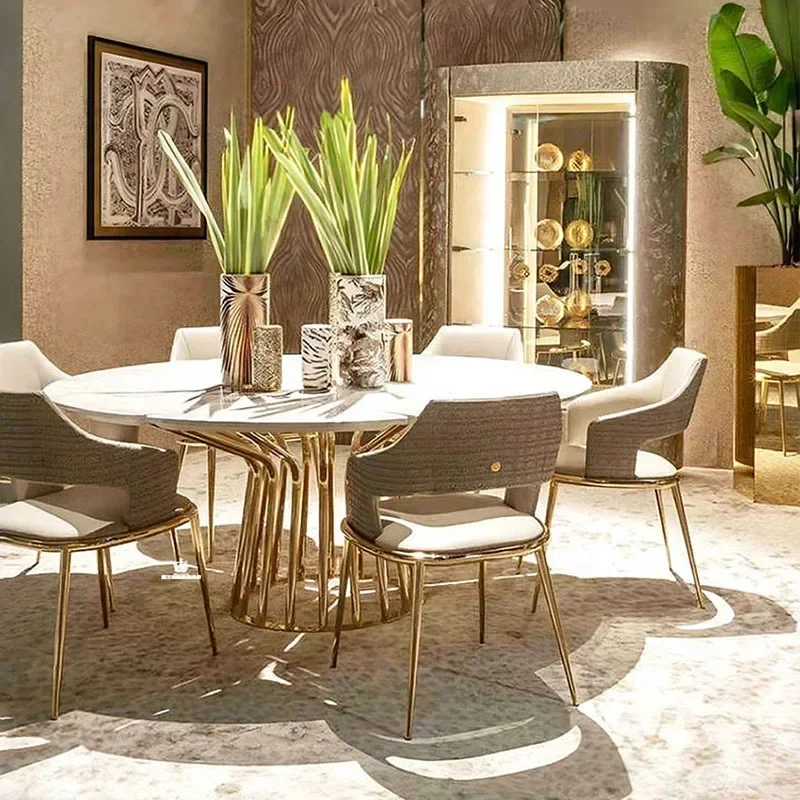 Mesa de comedor italiana y silla, combinación ligera de lujo, mesa redonda de mármol de alta gama, comedor moderno de acero inoxidable de alta gama para el hogar