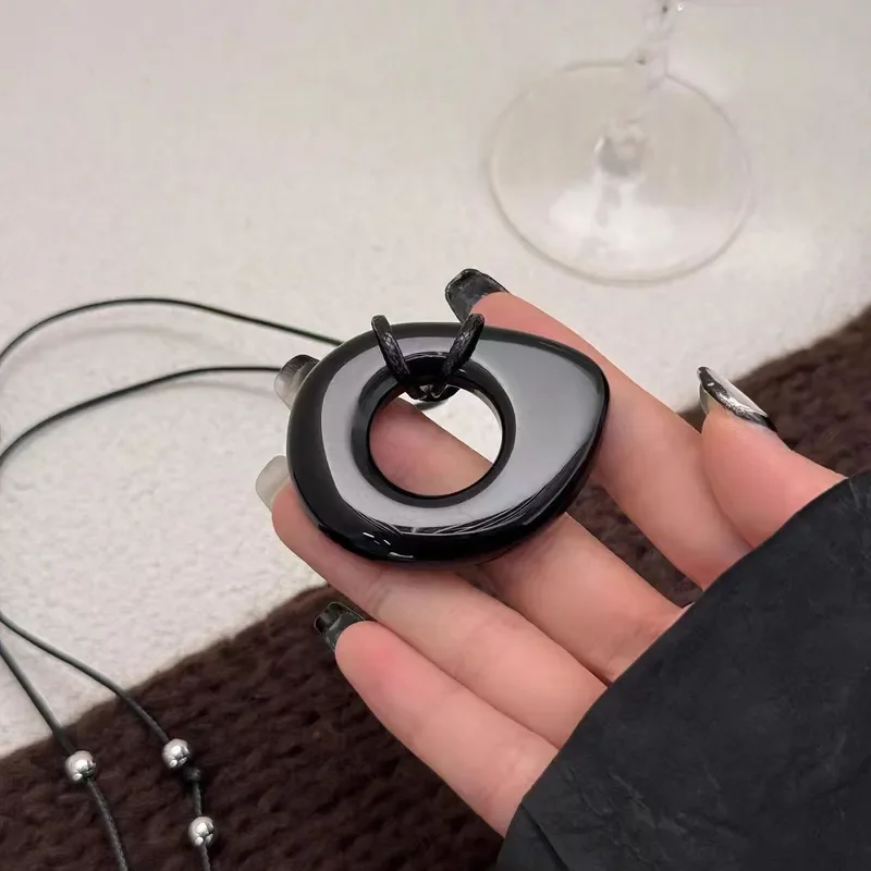 Obsidian leather rope necklace women's niche simple design autumn and winter sweater chain versatile high-end long pendant